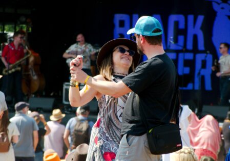 Man and woman dance in each other's arms